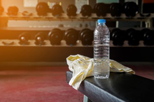 Gym towel and water bottle in a gym