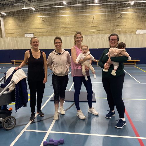 Group of 4 mums with their babies at a parent and baby class