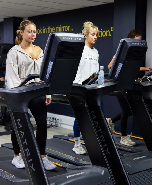 students working out on a treadmill