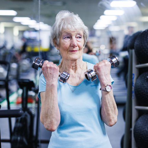 senior lady using dumbells