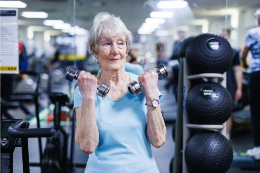 senior lady working out with dumbells