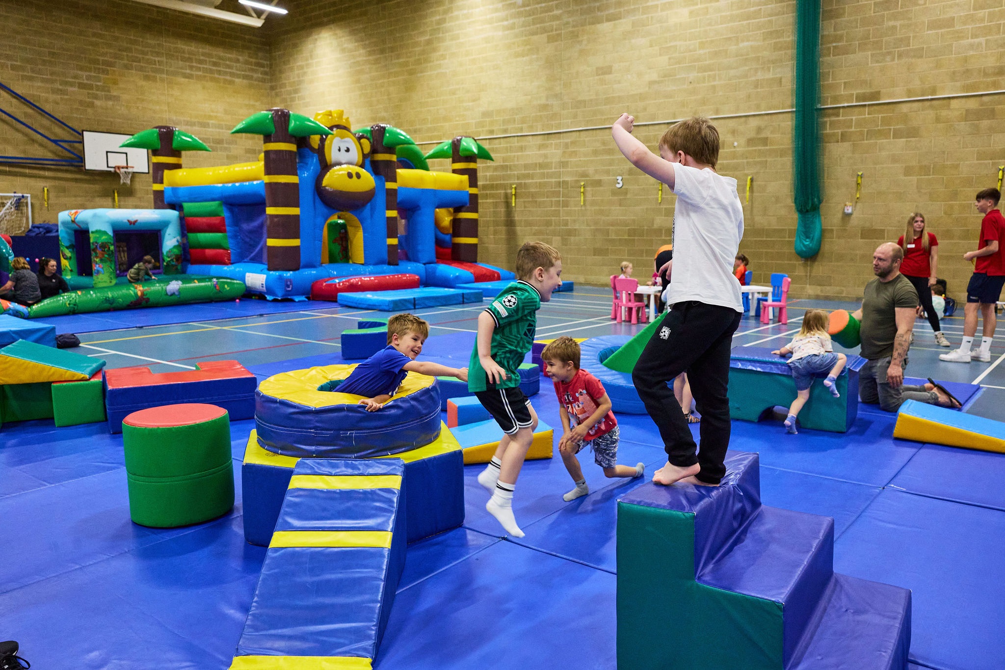 kids playing in a soft play area