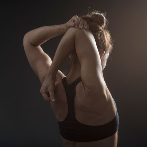 woman doing shoulder stretches