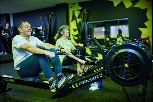 man using a rowing machine