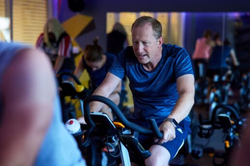 man on bike in indoor cycling class